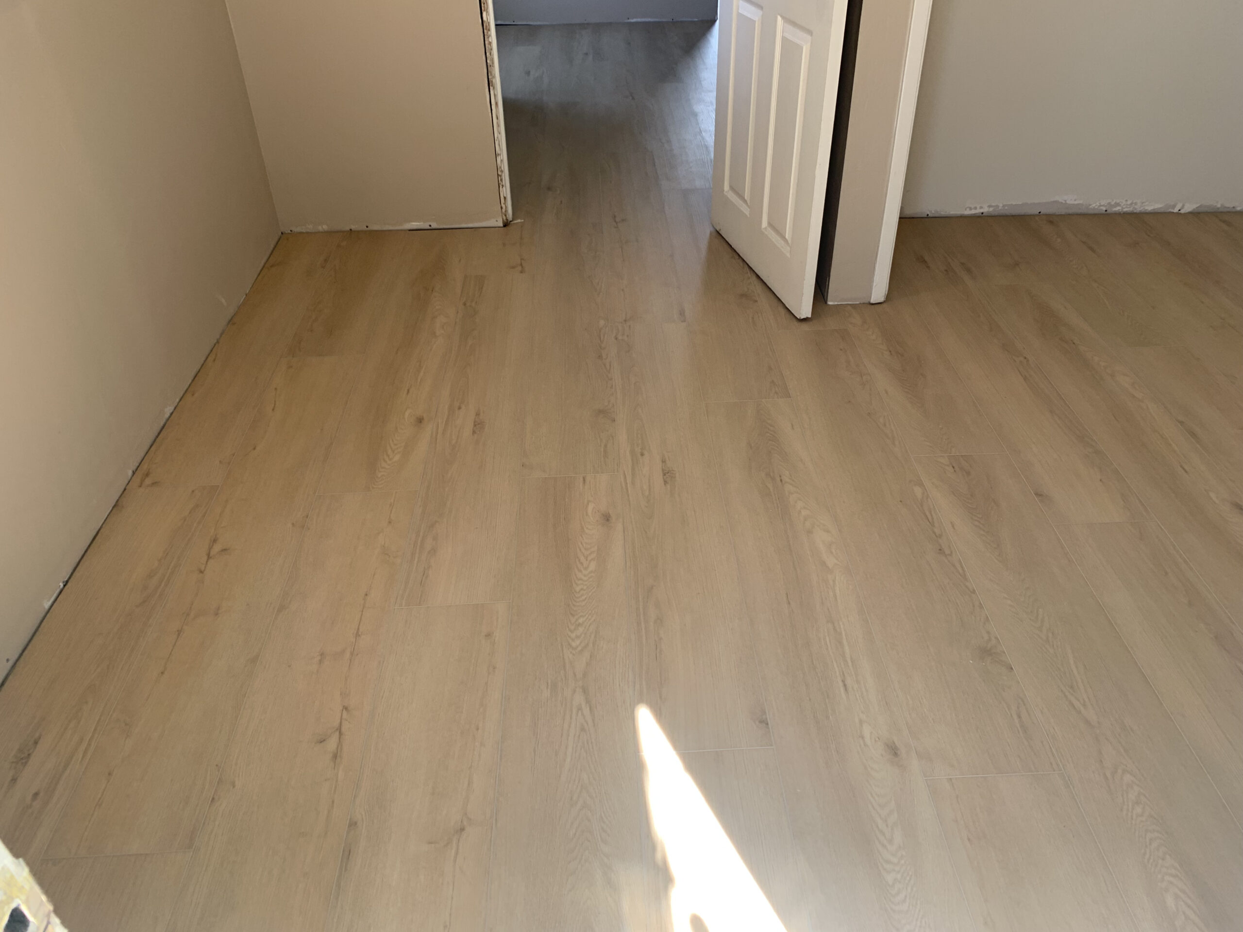 Flooring installation detail work in a San Diego home